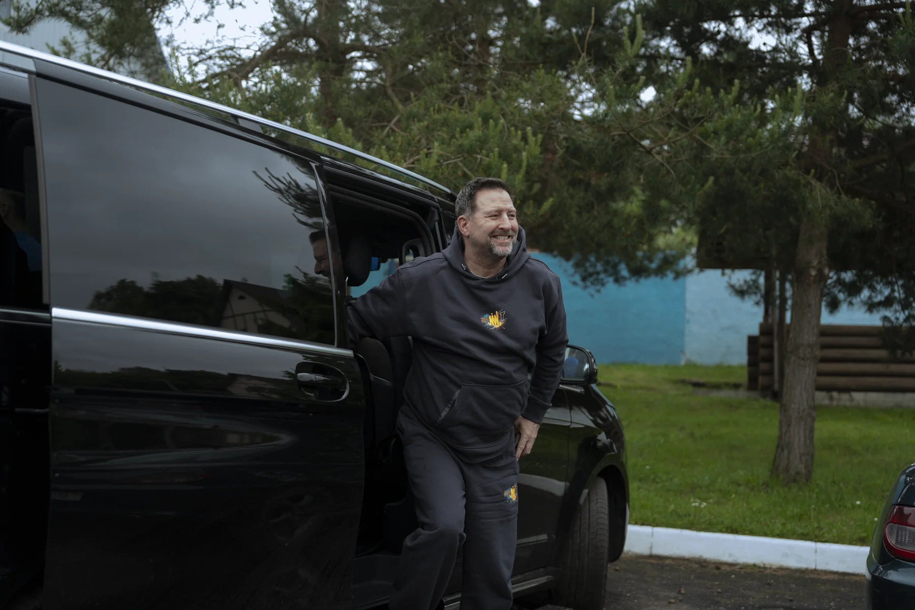 Brad Barton stepping out of a car
